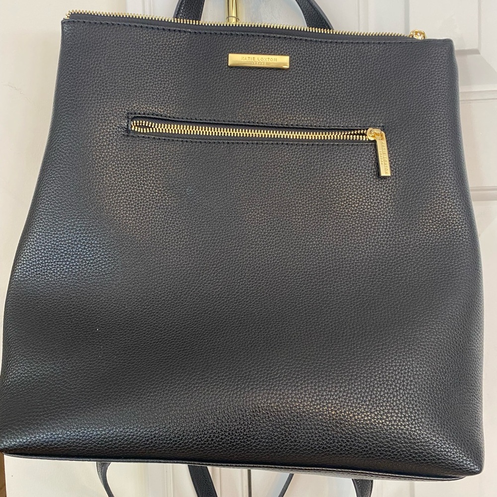 Soft RPEt based made plastic bottles. Rounded top handle handy shoulder straps